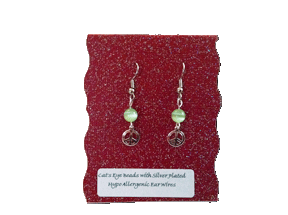 Earrings on Maroon Background
